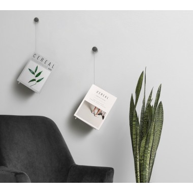 Magazine hangs out wall...