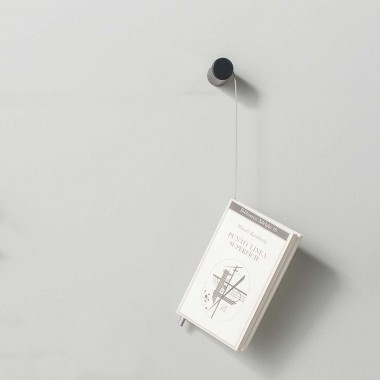 Magazine hangs out wall...